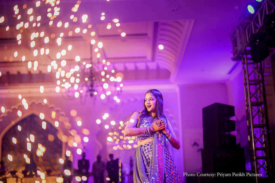 Bride wearing silver and blue lehenga for the sangeet