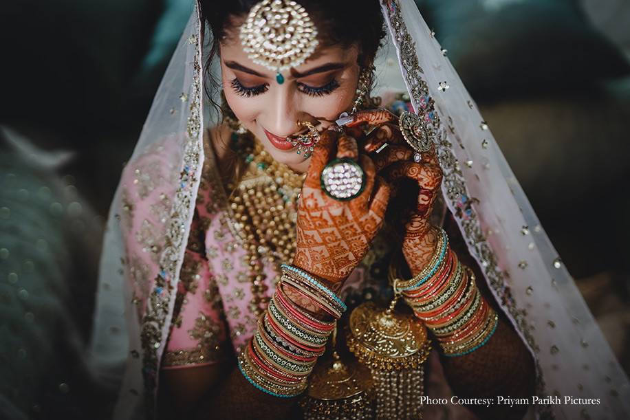 Bride wearing Blush pink lehenga
