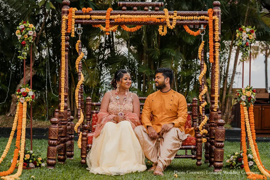 Haldi ceremony antique swing decorated with vivid marigolds