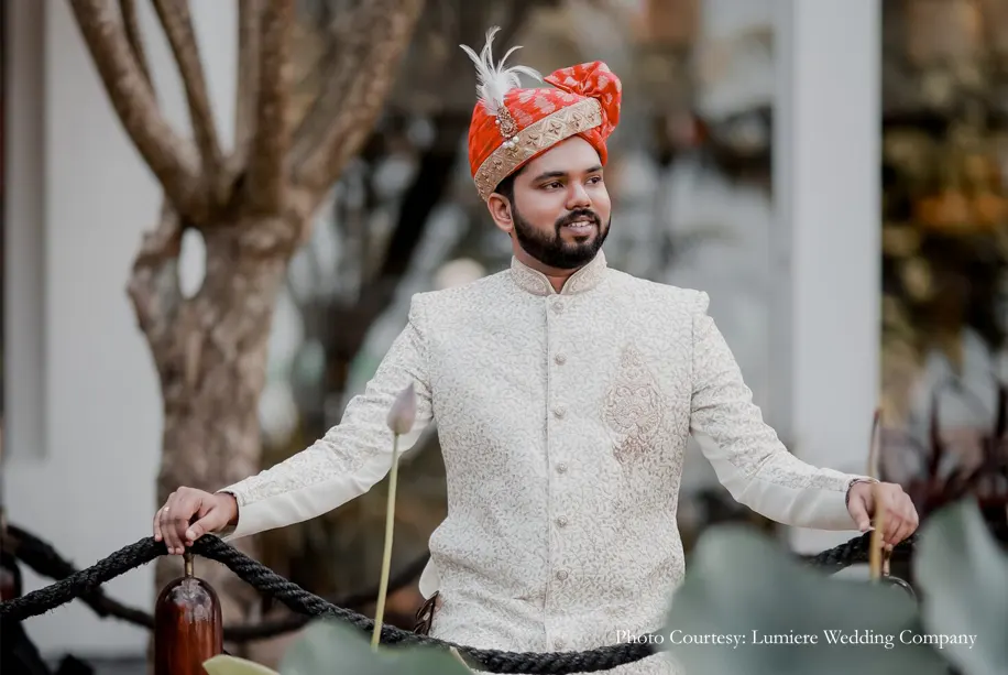 Bengali groom wearing white sherwani