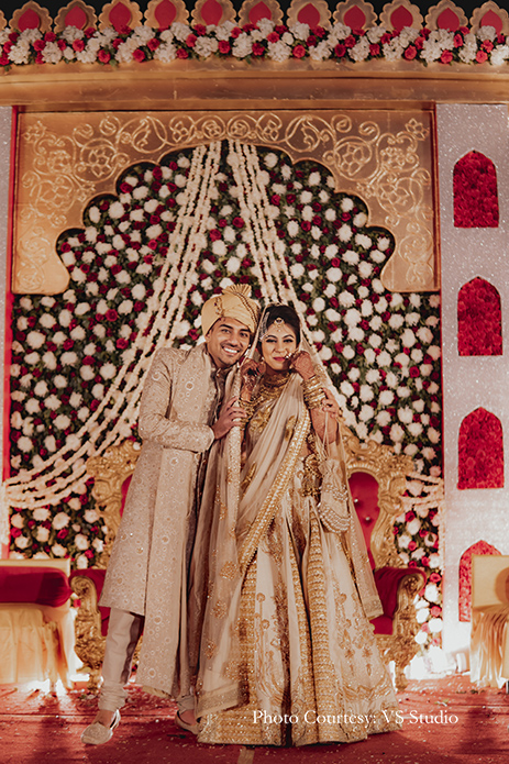 Bride wearing beige lehenga by Esha Sethi Thirani and groom wearing beige sherwani by Sood for Nikah