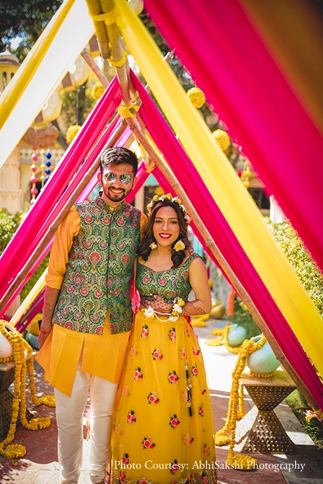 Couple twinning in yellow outfits by Haldi Ceremony