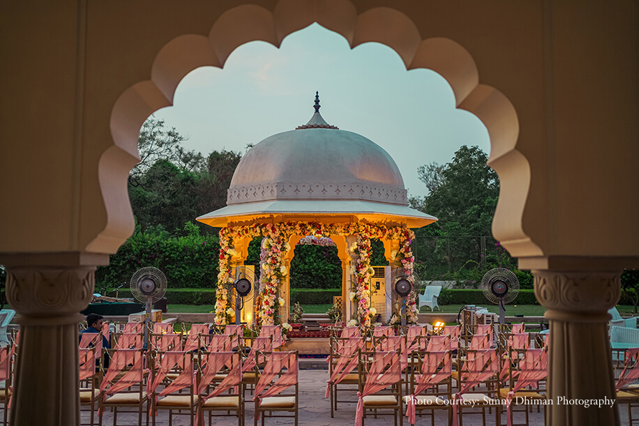 Mandap in red and gold decor under the night sky