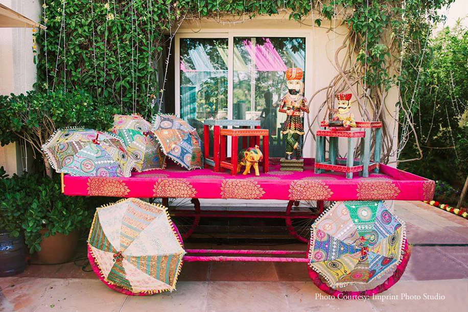 Mehndi celebration with marigold flower, fabrics and props of every color decor at bride’s family home
