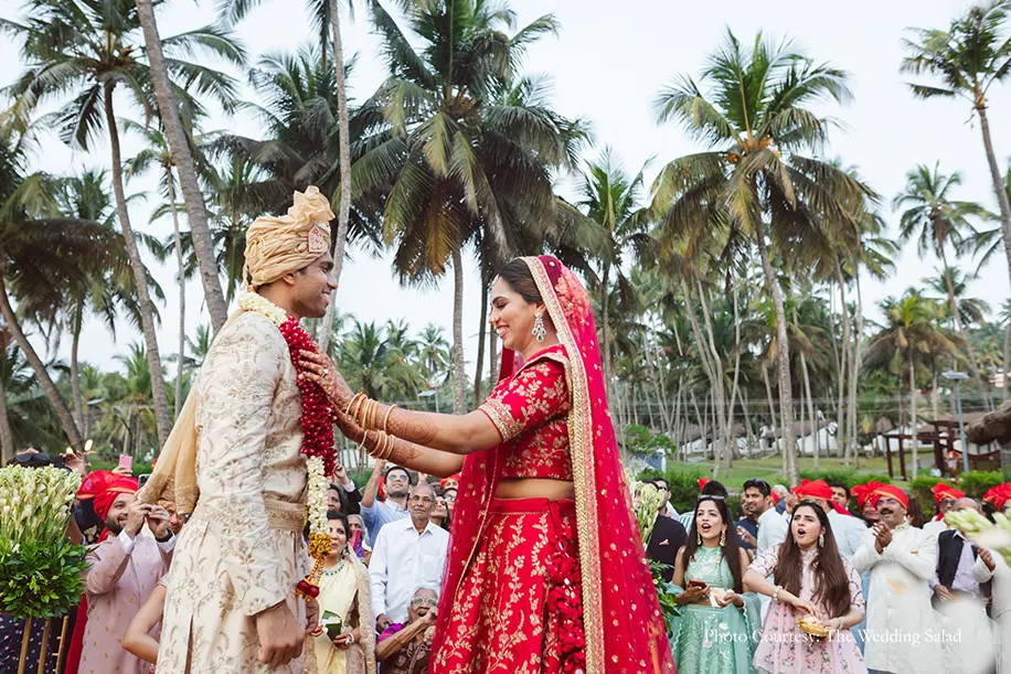 Couple in Sabyasachi outfit for the varmala ceremony