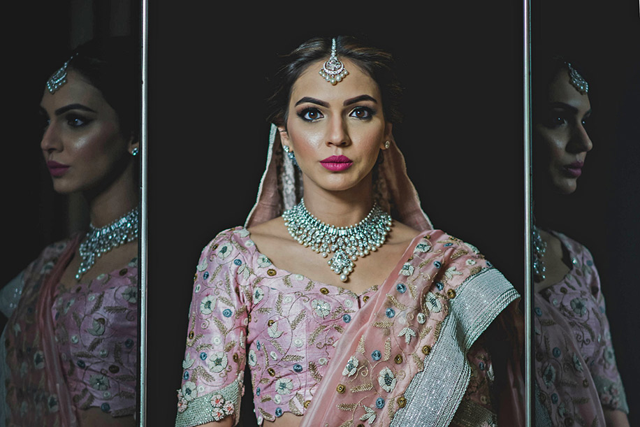 This fashion-forward bride planned her elegant bridal looks featuring a pastel palette